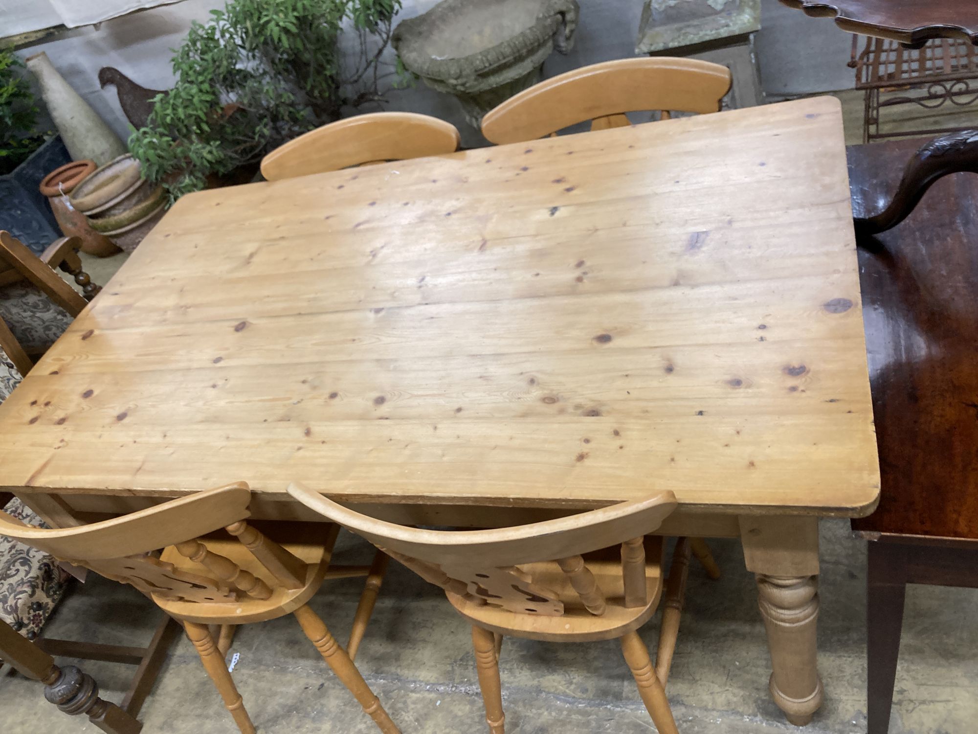 A Victorian style rectangular pine kitchen table, length 152cm, depth 90cm, height 78cm, together with four Windsor beech kitchen chairs
